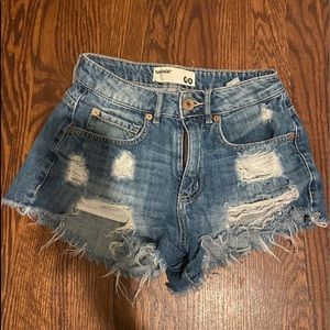 medium wash ripped jean shorts